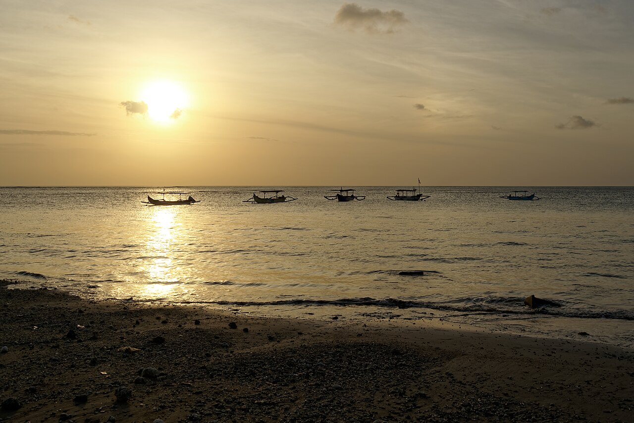Scooter parked along a Bali rice field road