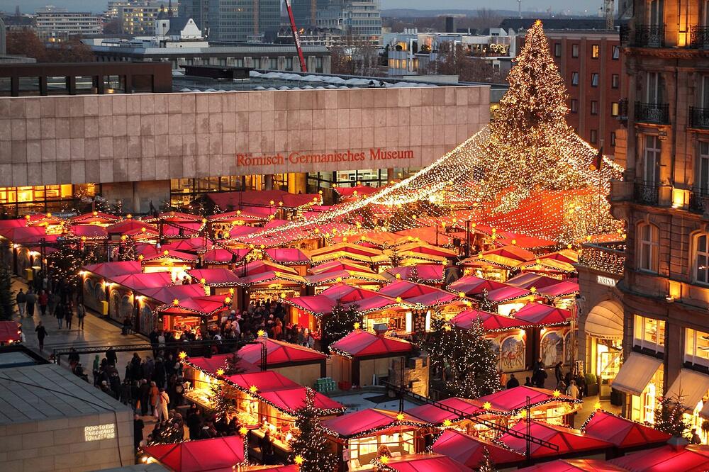 The Cathedral Christmas market on Roncalliplatz at dusk, Cologne