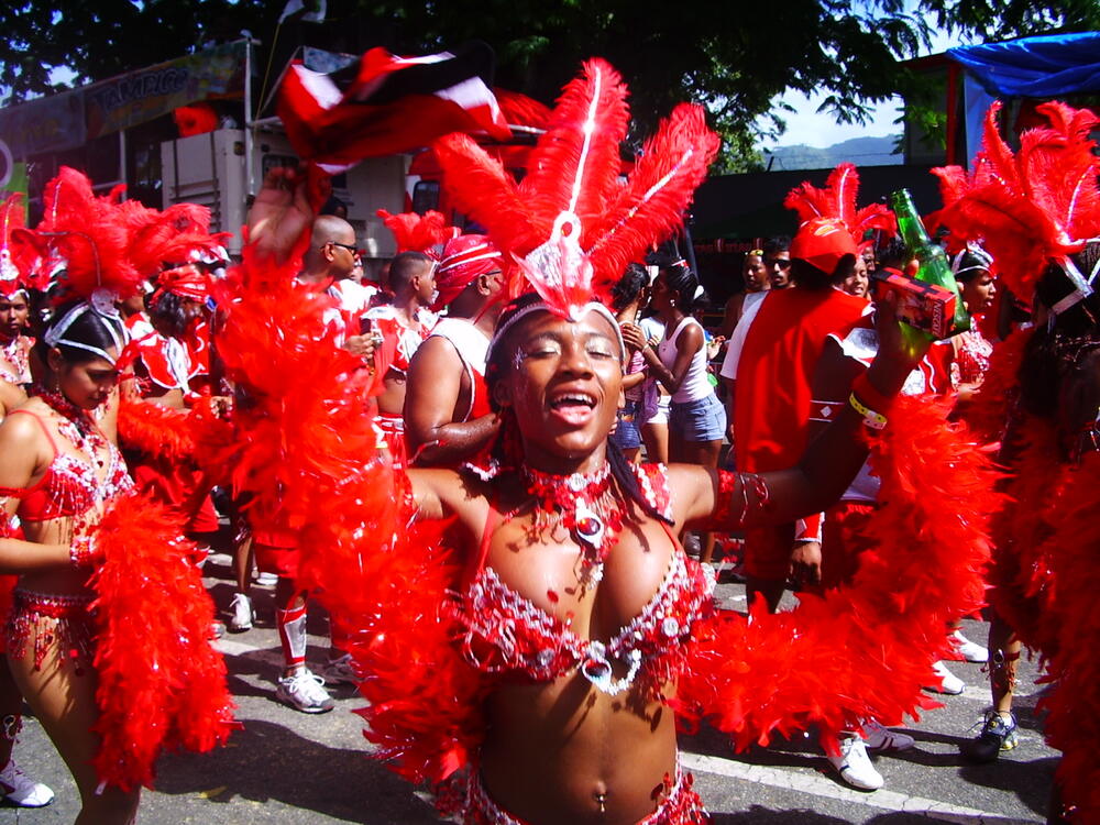 Masqueraders in red feathered costumes on Carnival Monday, Port of Spain, February 2006