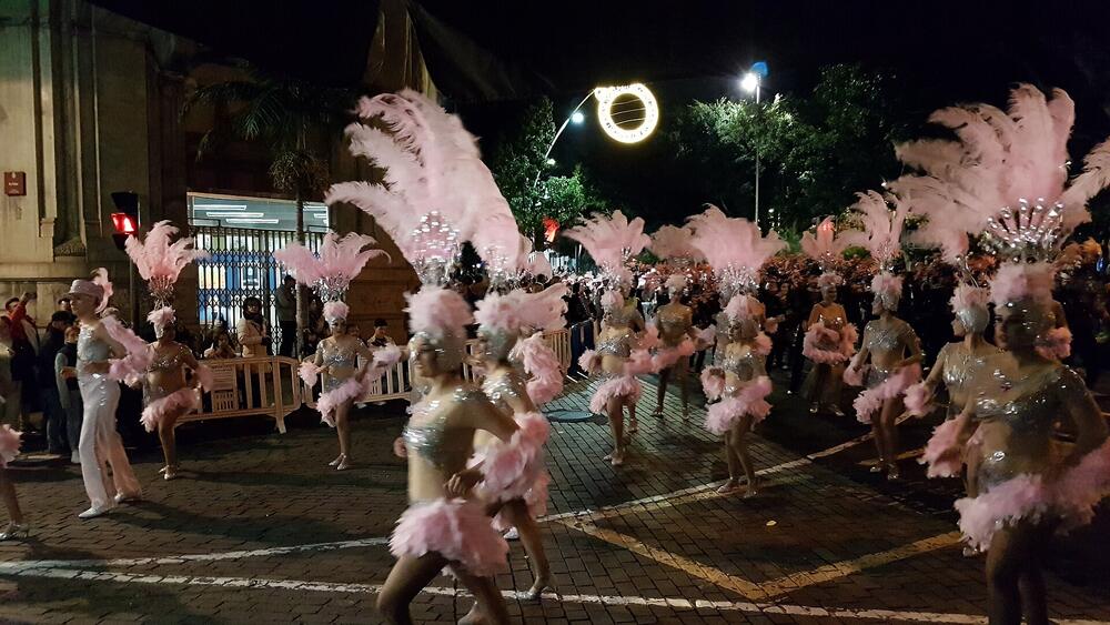 Feathered dancers parading at night, Carnaval de Santa Cruz de Tenerife, February 2023