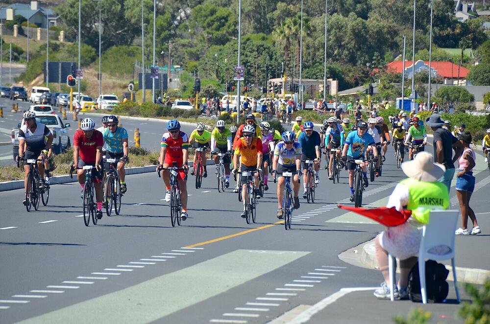 Riders in the Cape Town Cycle Tour passing through Sun Valley, 10 March 2024