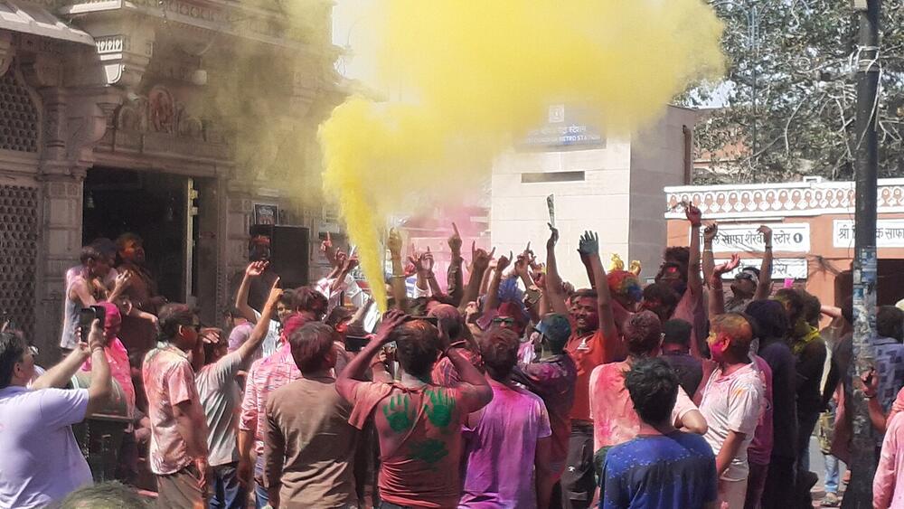 Holi crowds and colored powder in Jaipur's old city, March 2025